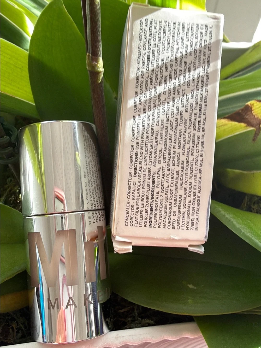 Milk Makeup Primer Stick in Shiny Silver Case with Soft Pink Box